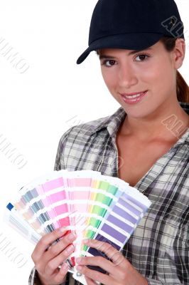 Painter holding a spectrum of colour samples