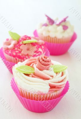 Vanilla cupcakes with various decorations