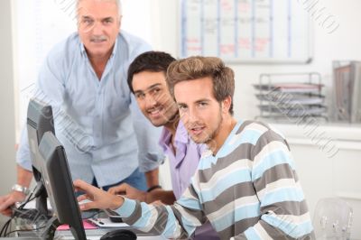 Young men working at their computers