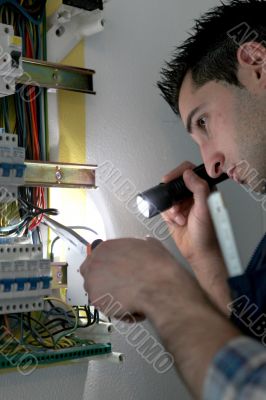 Man repairing electrical panel