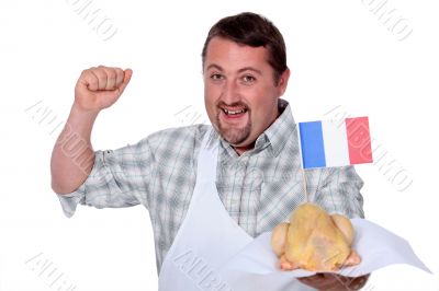 Man in a white apron celebrating French poultry