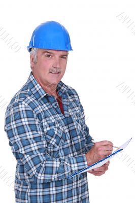 Construction foreman evaluating an employee