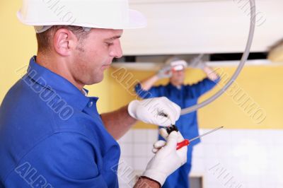 Two electrical engineers working