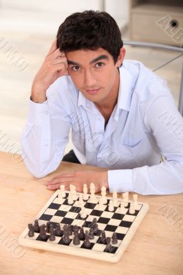 boy playing chess boy playing chess