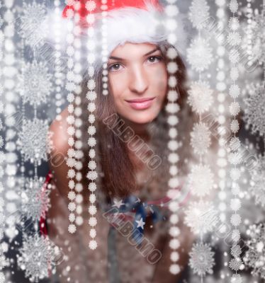 20-25 years old beautiful woman in christmas hat and swimsuit