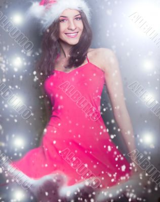 20-25 years od beautiful woman in christmas dress dancing at club.