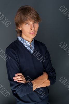 Portrait of a business man against grey background. Studio shot.