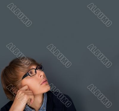 Image of young man thinking of his plans. Lots of copyspace.