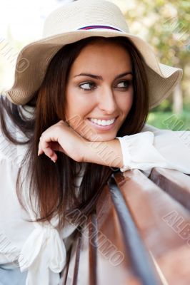 Portrait of a sexy young female smiling in a park.