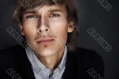 Portrait of young esquire man with smart and wise look. Portrait of young esquire man with smart and wise look.