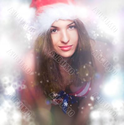 20-25 years old beautiful woman in christmas hat and swimsuit.