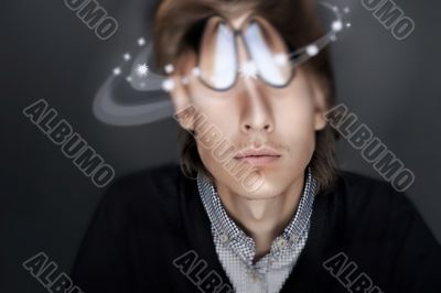 Young Business man against gray background. Distorted head and c