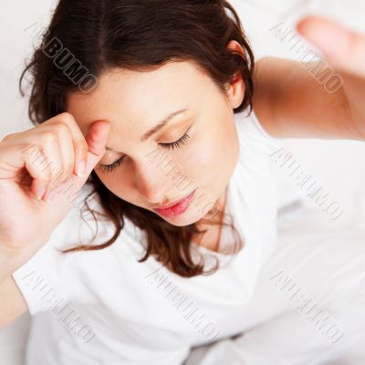 Portrait of a charming young lady relaxing on couch