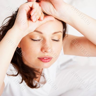 Portrait of a charming young lady relaxing on couch