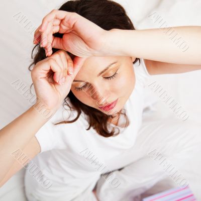 Portrait of a charming young lady relaxing on couch