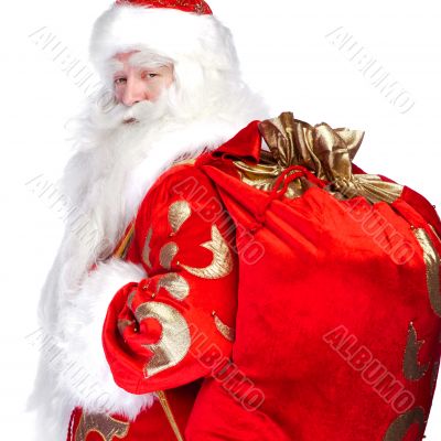 Santa Claus standing up on white background with his bag full of