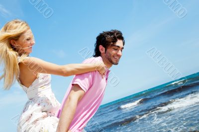 Couple in love - Hispanic man having his caucasian woman piggyba