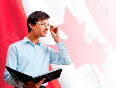 Portrait of adult man wearing formal clothes and glasses holding