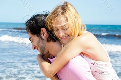 Couple in love - Hispanic man having his caucasian woman piggyba