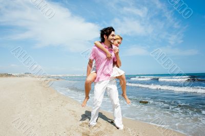 Couple in love - Hispanic man having his caucasian woman piggyba