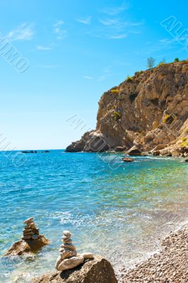 Bright view of calm wild beach of spanish coast line. Clean Medi Bright view of calm wild beach of spanish coast line. Clean Medi