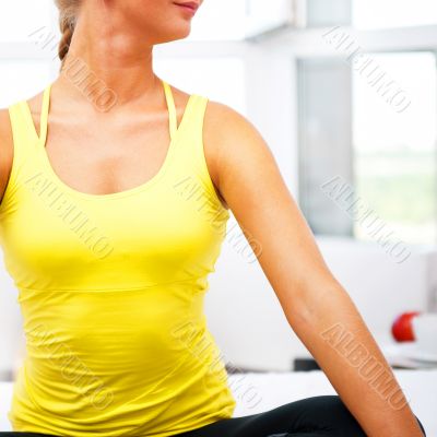 Portrait of beautiful young woman resting after doing exercise a