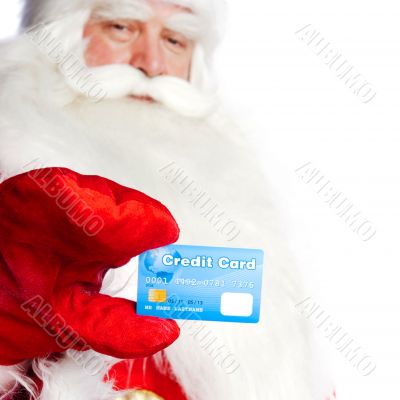 Traditional Santa Claus holding and sowing credit card while giv