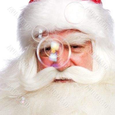 Santa Claus portrait smiling isolated over a white background an