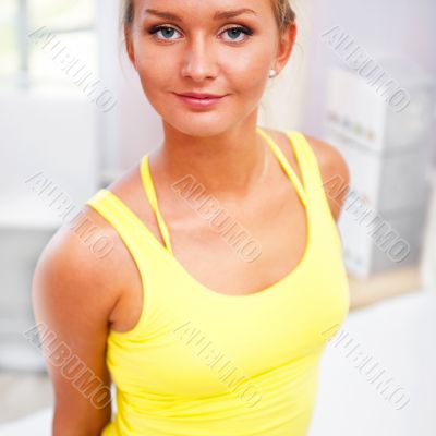 Portrait of beautiful young woman resting after doing exercise a