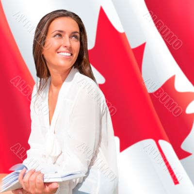 Portrait of pretty young woman holding book in her arms. Canadia
