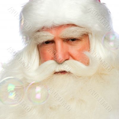 Santa Claus portrait smiling isolated over a white background