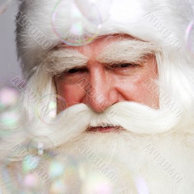 Santa Claus portrait smiling isolated over a white background an