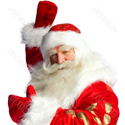 Santa Claus pointing his hand isolated over white.