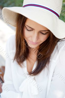 Beautiful young elegant woman wearing hat outdoor at park she is