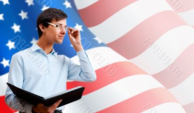 Portrait of adult man wearing formal clothes and glasses holding
