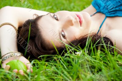 Pretty brunette girl wearing elegant dress relaxing outdoor in g