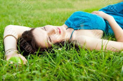 Pretty brunette girl wearing elegant dress relaxing outdoor in g