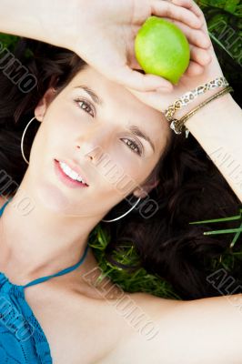 Pretty brunette girl wearing elegant dress relaxing outdoor in g Pretty brunette girl wearing elegant dress relaxing outdoor in g