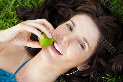 Pretty brunette girl wearing elegant dress relaxing outdoor in g Pretty brunette girl wearing elegant dress relaxing outdoor in g