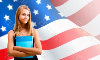 Portrait of pretty young woman holding book in her arms. USA Fla
