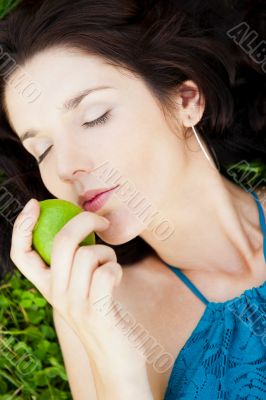 Pretty brunette girl wearing elegant dress relaxing outdoor in g