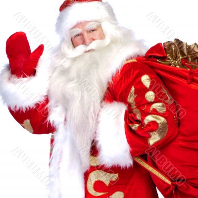 Santa Claus standing up on white background with his bag full of