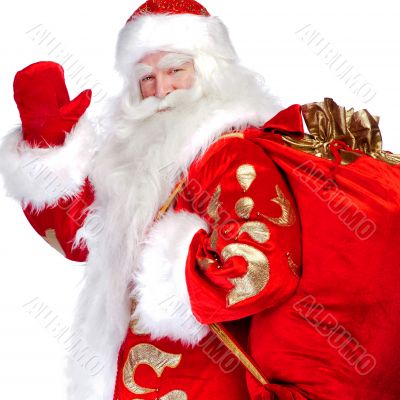 Santa Claus standing up on white background with his bag full of