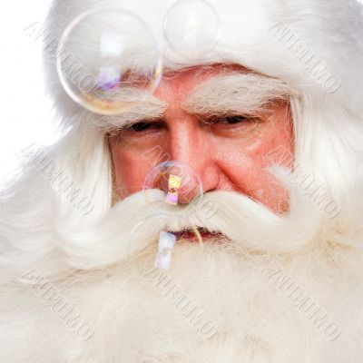 Santa Claus portrait smiling isolated over a white background an