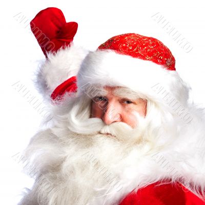 Santa Claus pointing his hand isolated over white.