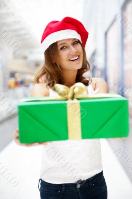 Portrait of young excited pretty woman wearing Santa Claus helpe