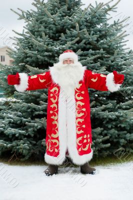 Full Length Portrait of Santa Claus standing with open hands out