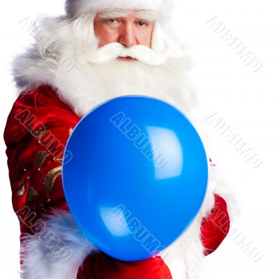 Traditional Santa Claus holding balloons for children. Isolated 