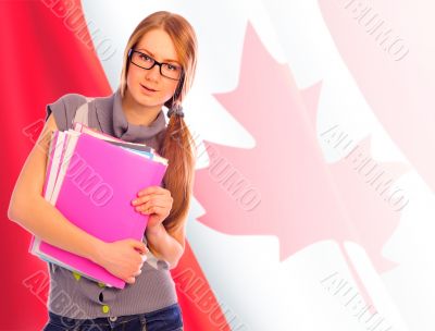 Portrait of pretty young woman holding book in her arms. Canadia