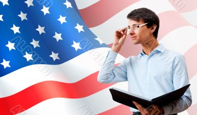 Portrait of adult man wearing formal clothes and glasses holding